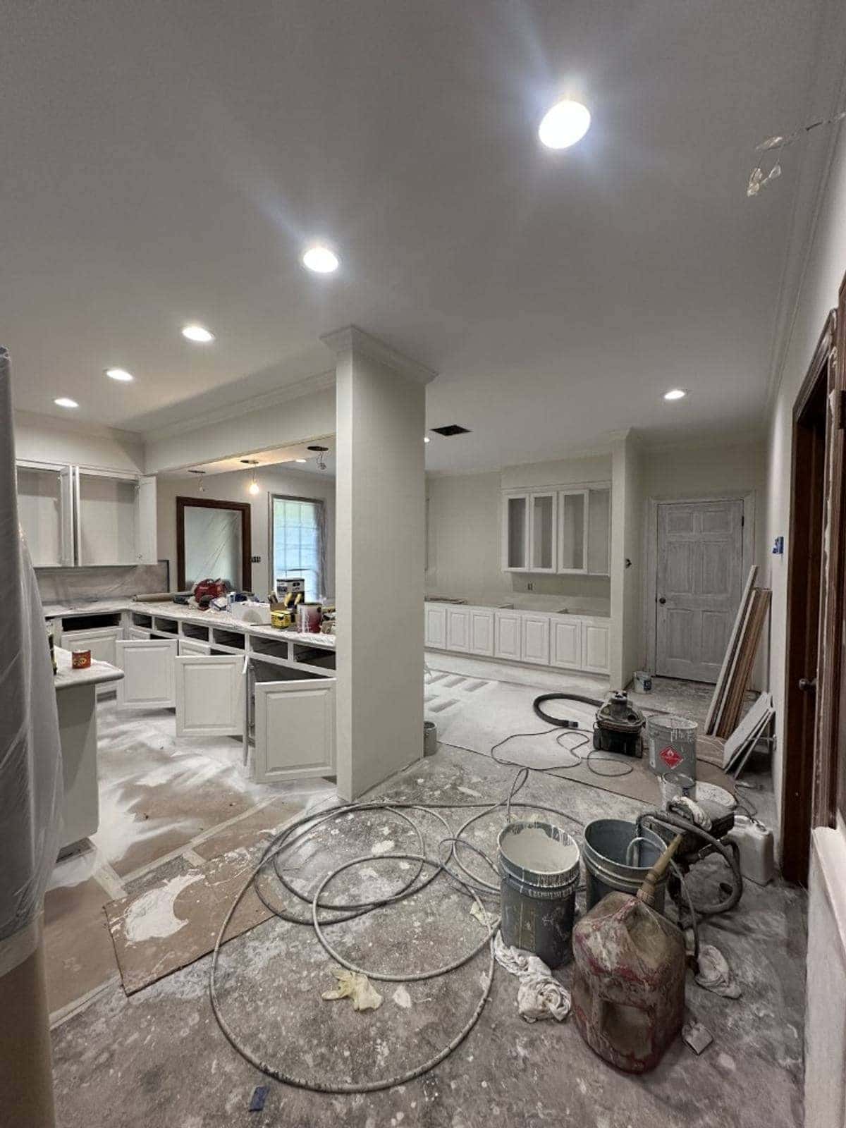 Kitchen mid-refurbishment with dust, tools and debris — the kind of site Sufloria prepares after builders leave
